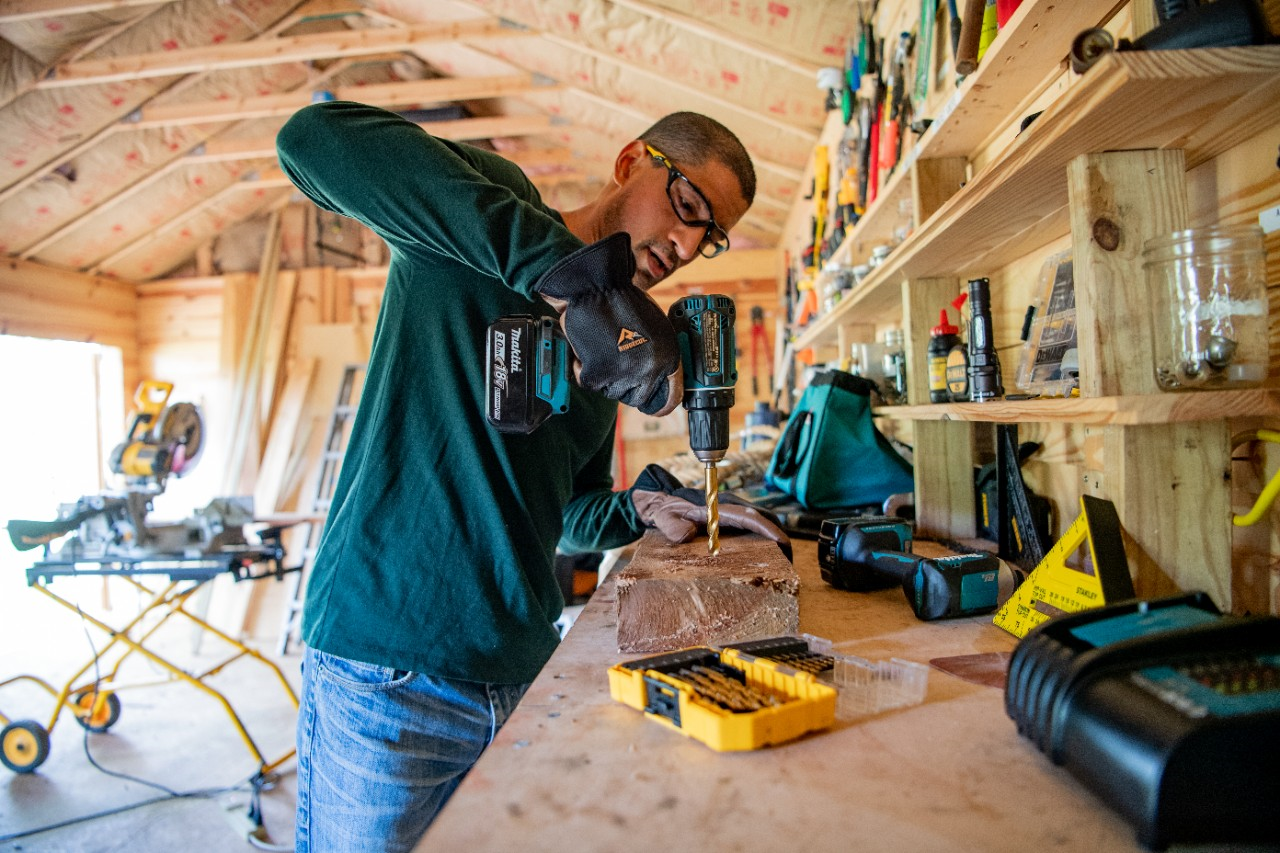 Man using power tools in garage
