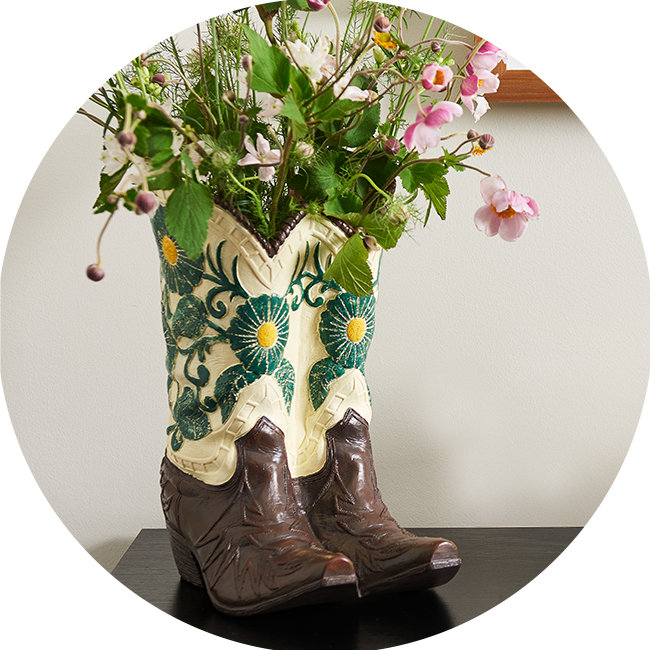 Category tile labelled pots and planters. Shop now.