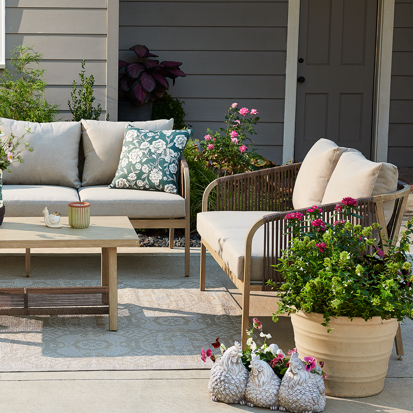 Red Shed outdoor wicker-style sofa set with cushions and coffee table. See items.