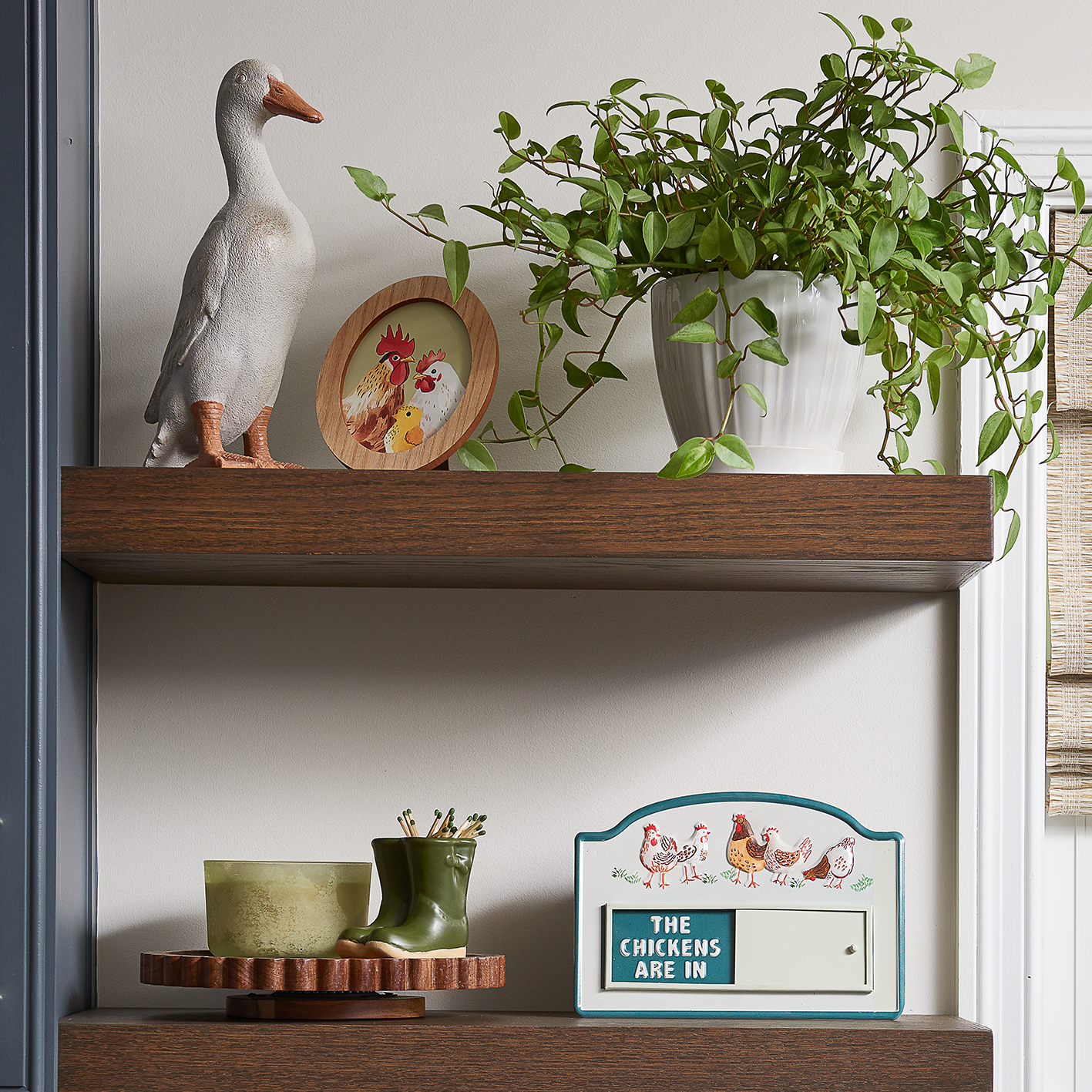 Red Shed farmhouse shelf with duck figurine and potted plant. See items.
