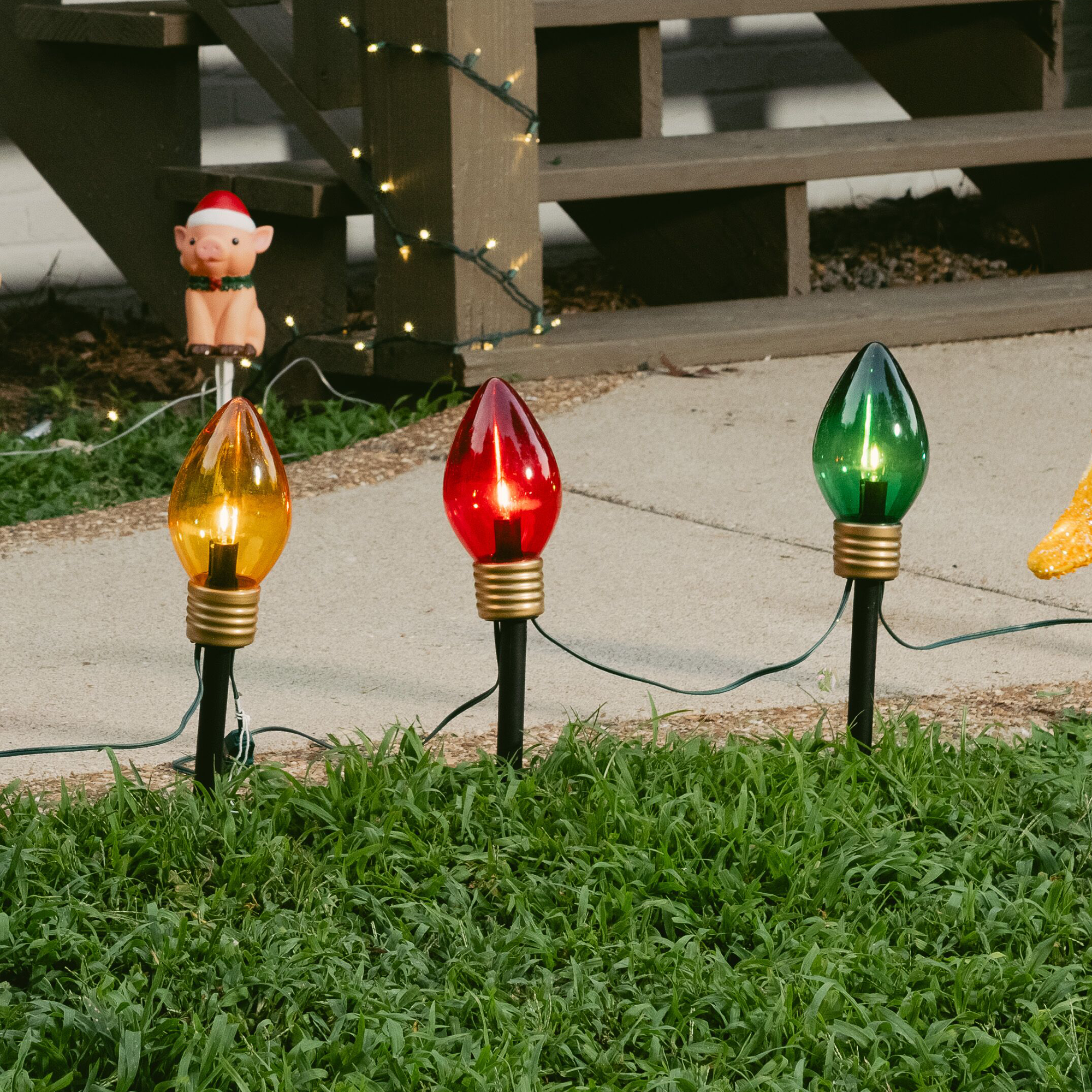 Lighted outdoor Christmas decorations are shown. Shop Christmas lights.