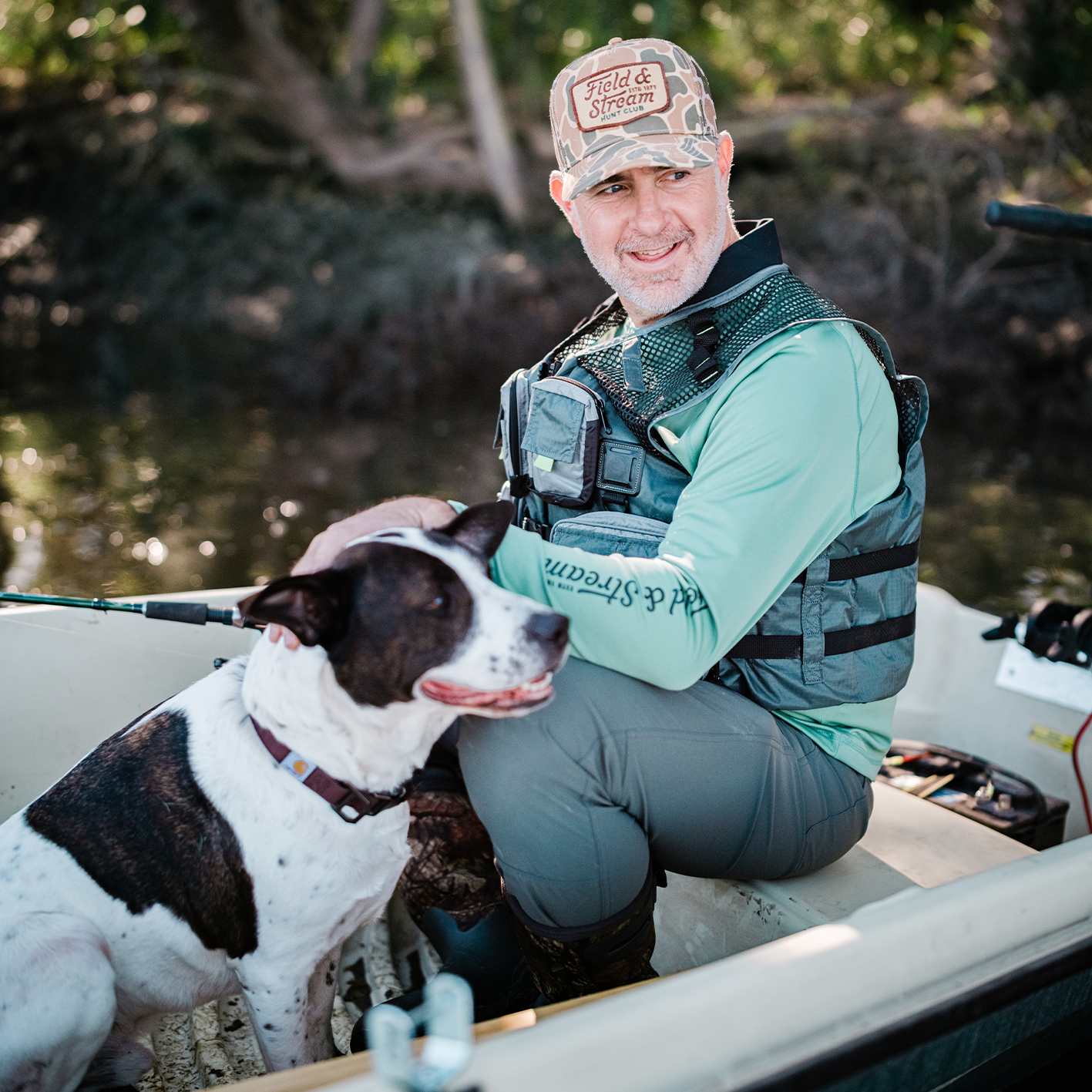 Shop the look for Field and Stream at Tractor Supply, featuring man with dog outdoors.
