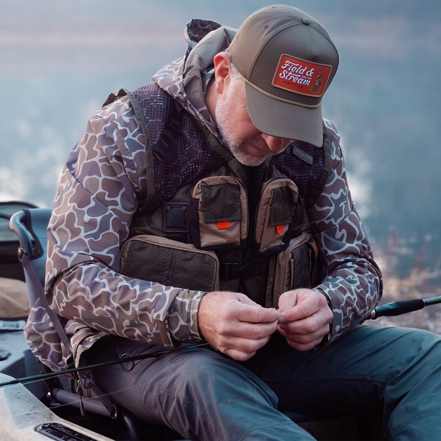 Shop the look for Field and Stream featuring man in camo gear sitting outdoors.