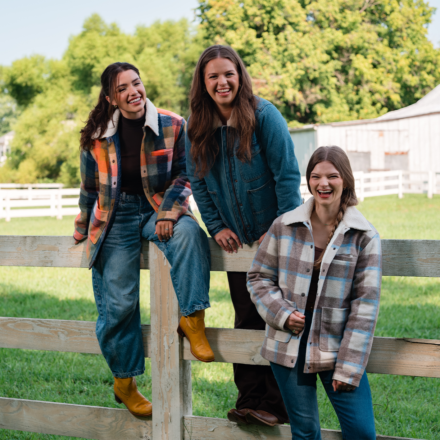 Three women wearing fall jackets and jeans are shown. See items.