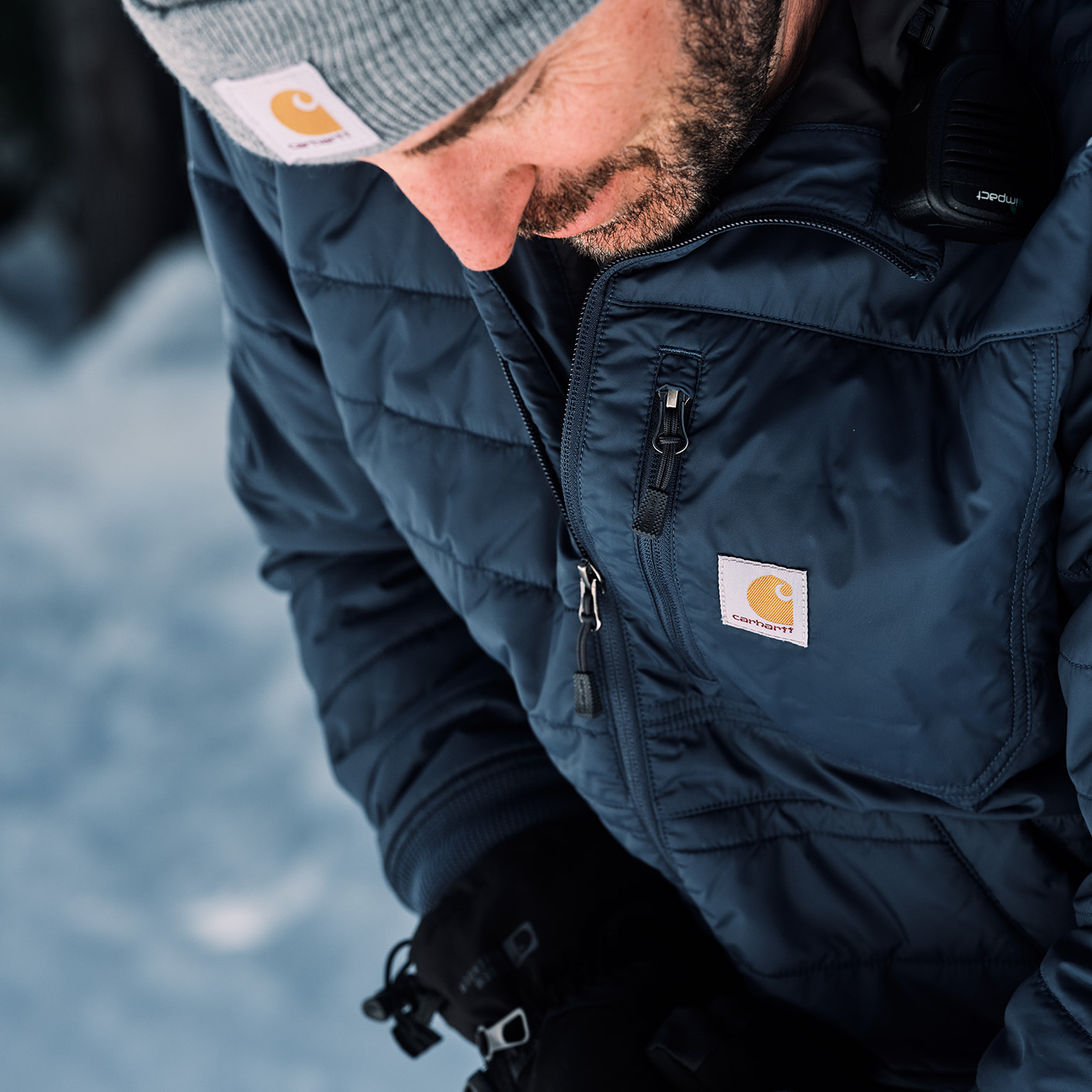 Man wearing a Carhartt beanie cap and jacket