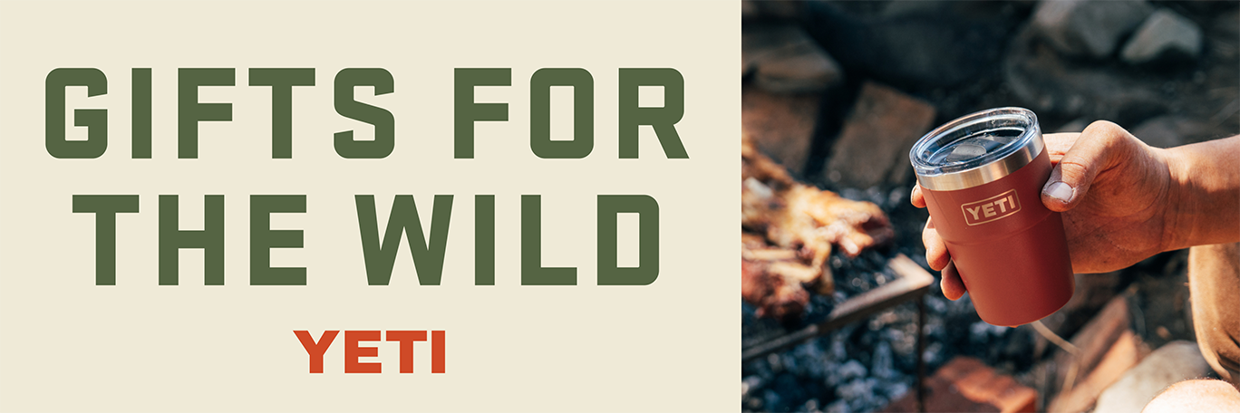 Alt text: A YETI tumbler is shown beside a campfire. Banner reads, gifts for the wild. YETI.