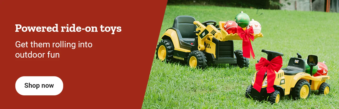 Kids’ ride on tractors decorated with bows are shown. Banner reads, powered ride-on toys. Get them rolling into outdoor fun. Shop now.