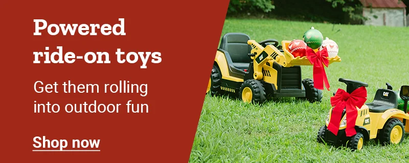 Kids’ ride on tractors decorated with bows are shown. Banner reads, powered ride-on toys. Get them rolling into outdoor fun. Shop now.