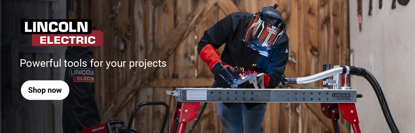 Man in protective gear welding