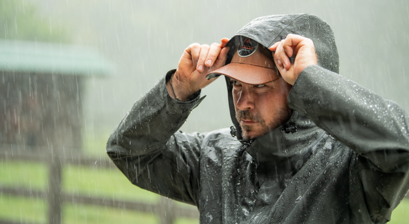 man standing in the rain