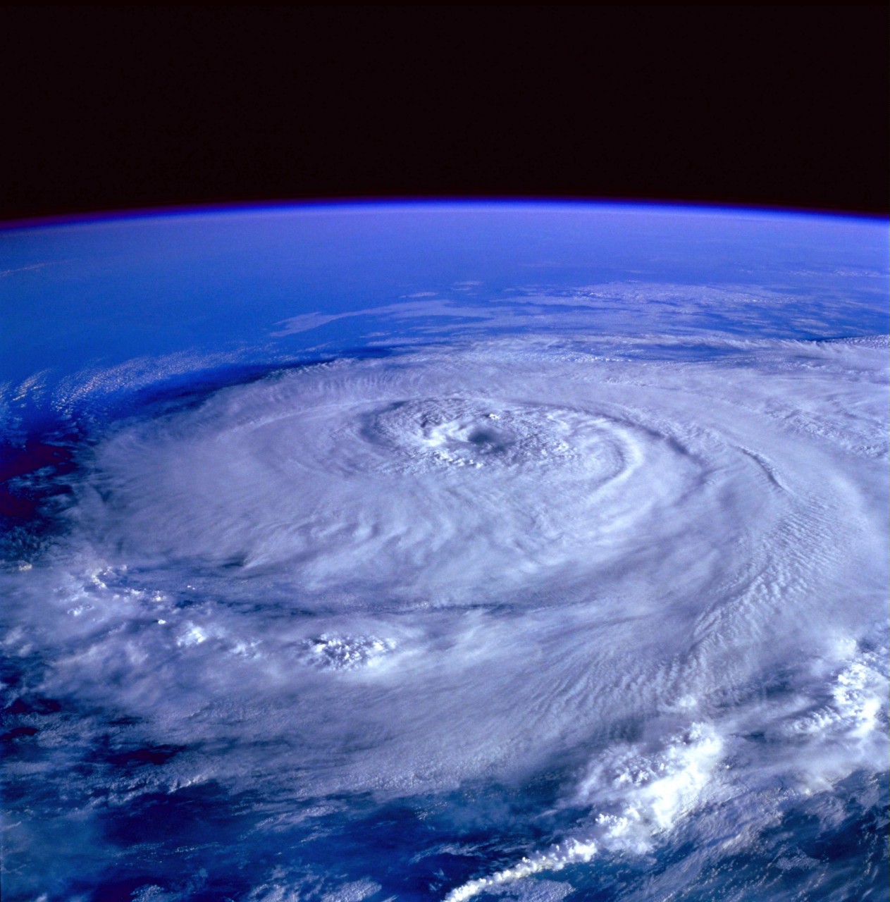 Aerial view of hurricane with eye of storm in center