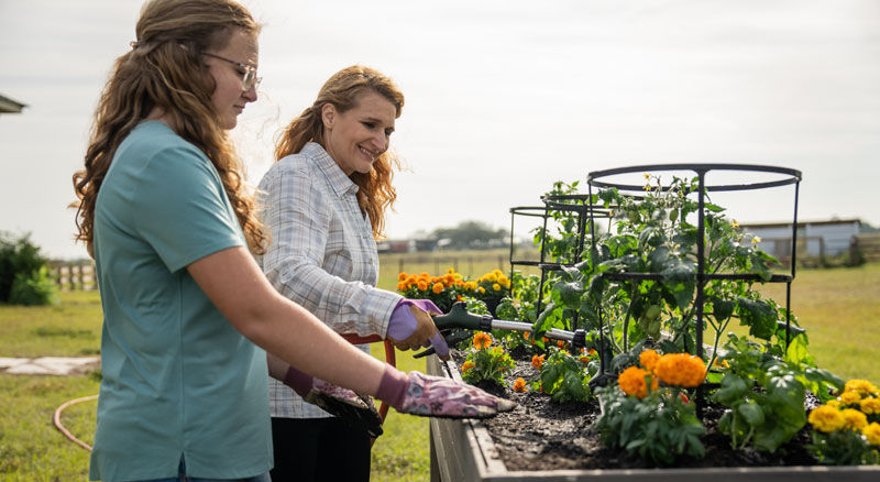 mother and daughter with plants