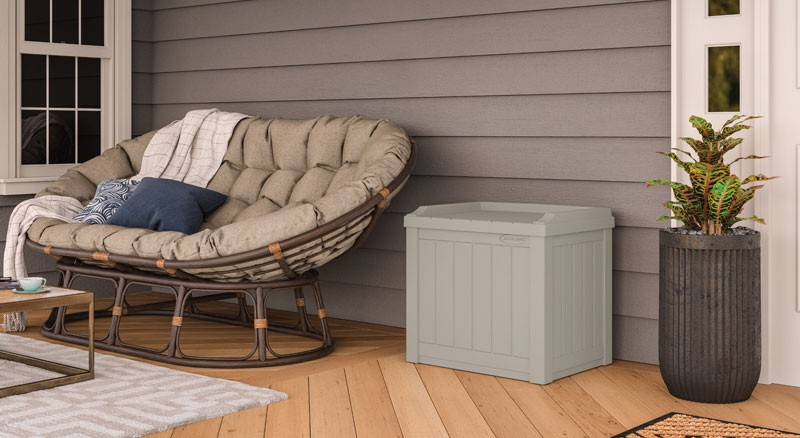 Patio with comfortable seating, storage, planter, rug and coffee table
