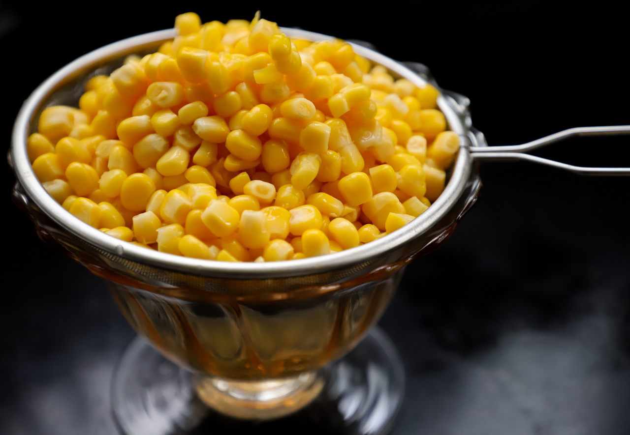 Image of corn kernels in a strainer.