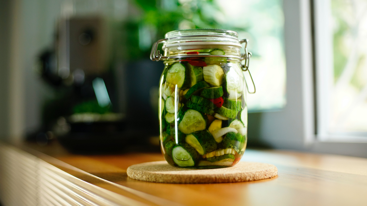 Image of cucumbers in a canning jar.