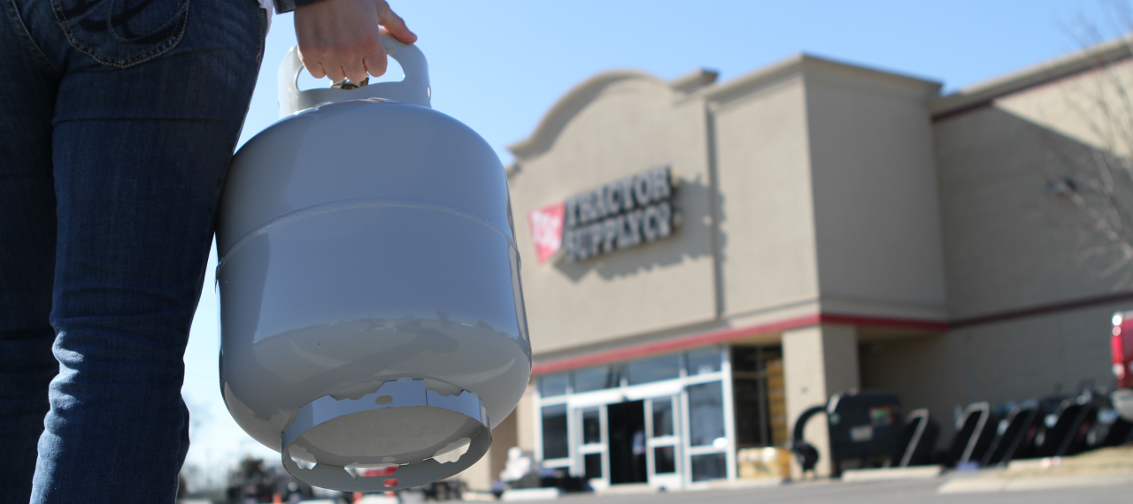 Customer filling propane at tractor supply store